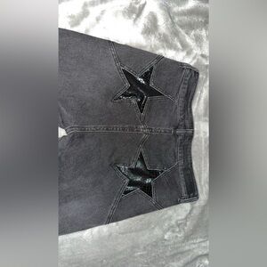 High rise rock and roll flare black jeans, with stars on the back pockets!